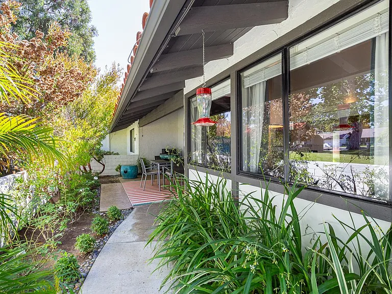 Wrap around the enclosed backyard. The waist-high fence allows views across the Back Bay, South Coast Plaza, and lush green belts.