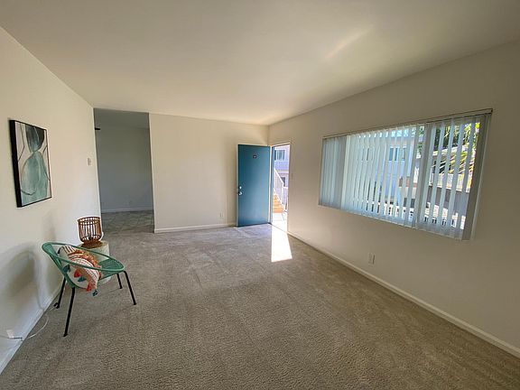 Living room looking to kitchen/dining area