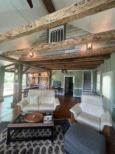 Living Area with Ekornes leather furniture, TV an EXPOSED and original ceiling beams