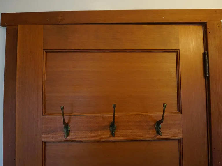 Bedroom door back with historic hooks