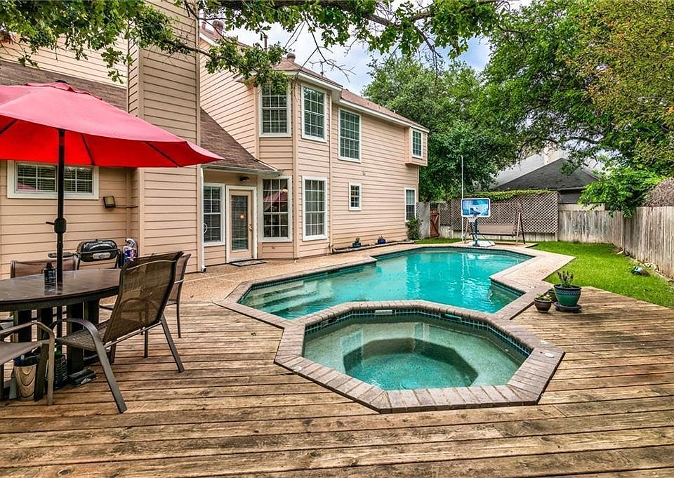 Pool and Hottub with a Finished Deck around the pool.
