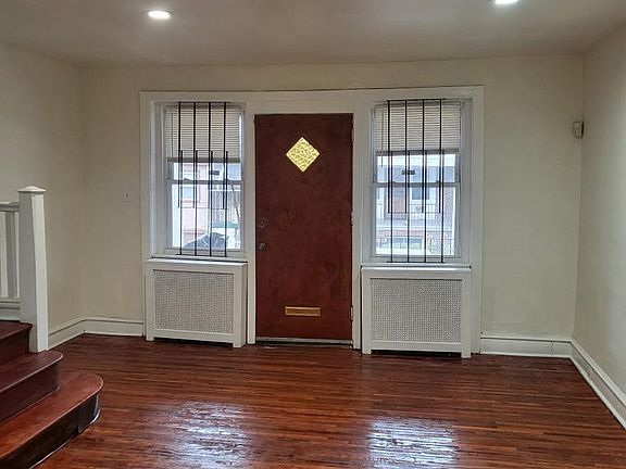 Entrance to Living Room; bars on windows to be removed once tenant moves in unless he/she wants them to remain.