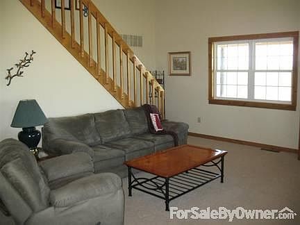 Entrance from the front door
						:
						The loft, vaulted ceilings, and many windows create an awesome first impression.