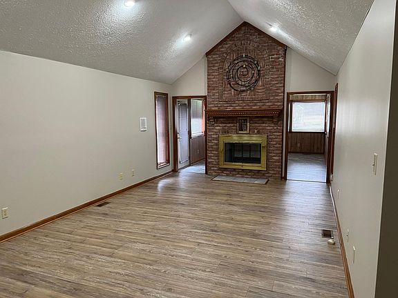 Greatroom and sunroom other side of fireplace