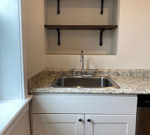 Kitchen sink with overhead shelving