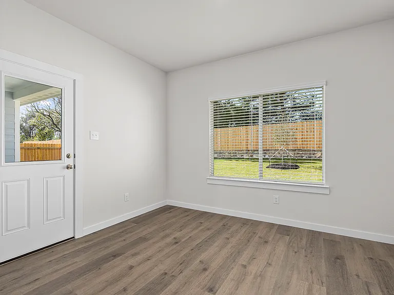 The dining room has large windows that let in great, natural light.