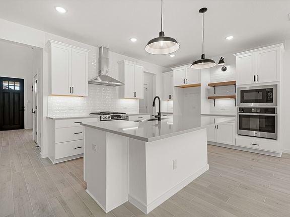 Kitchen with stylish floating shelves