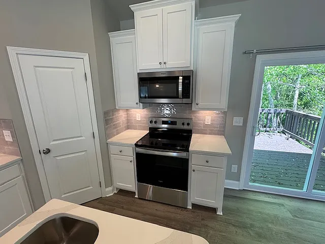 Kitchen counter, appliances and corner pantry