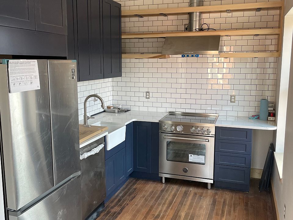 Kitchen with Bertazzoni induction range, dishwasher, and French door refrigerator.