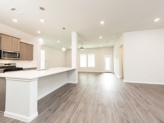 Dining Area and Kitchen to Family Room