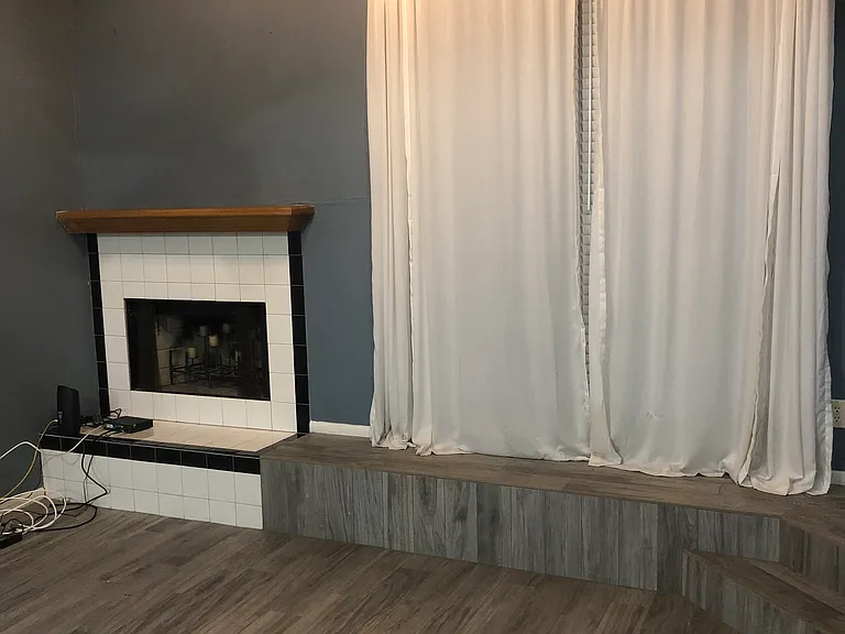 Wood burning fireplace and big window to patio