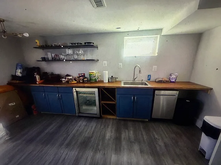 Designed for effortless entertaining, the full wet bar features a built-in wine chiller, dishwasher, and everything needed to host family and friends in style.