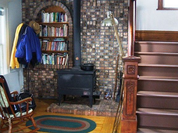 Woodstove in front entry - great for saving on your gas bills in winter!