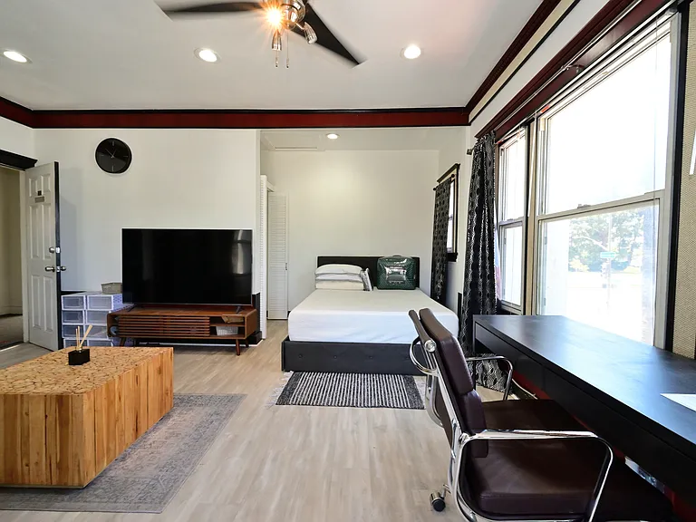 Fully Furnished & Updated LARGE and BRIGHT Studio w/ in-unit laundry + private balcony + parking