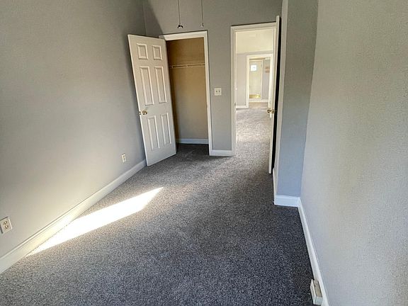 Bedroom 1with High Ceilings and Fan