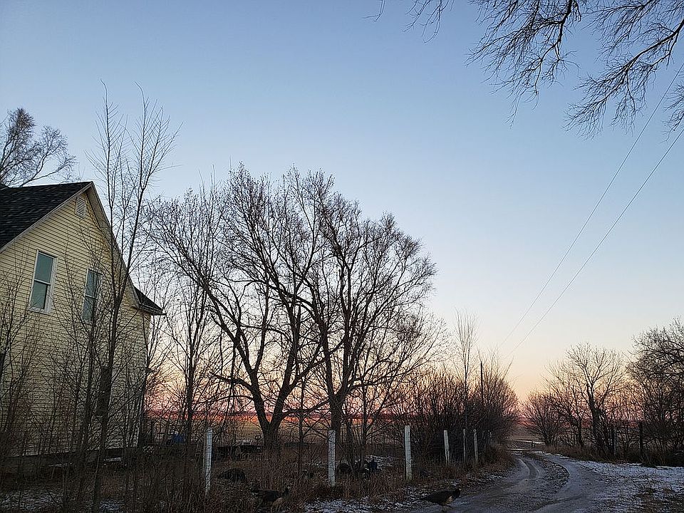 S side of house facing E at sunset