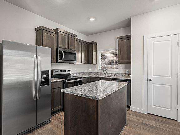 The kitchen has stainless-steel, energy-efficient appliances.