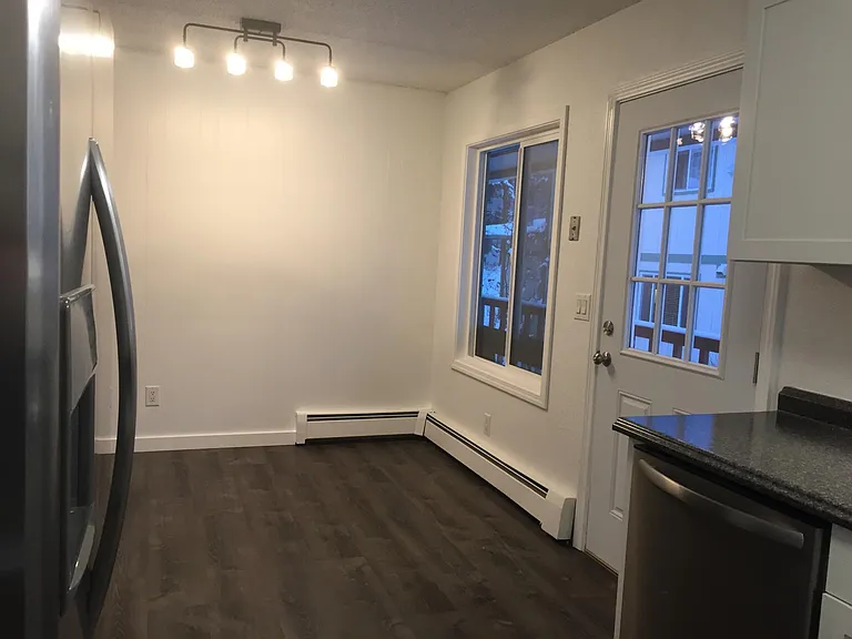 Kitchen and Dining Room with easy exterior access to Carport