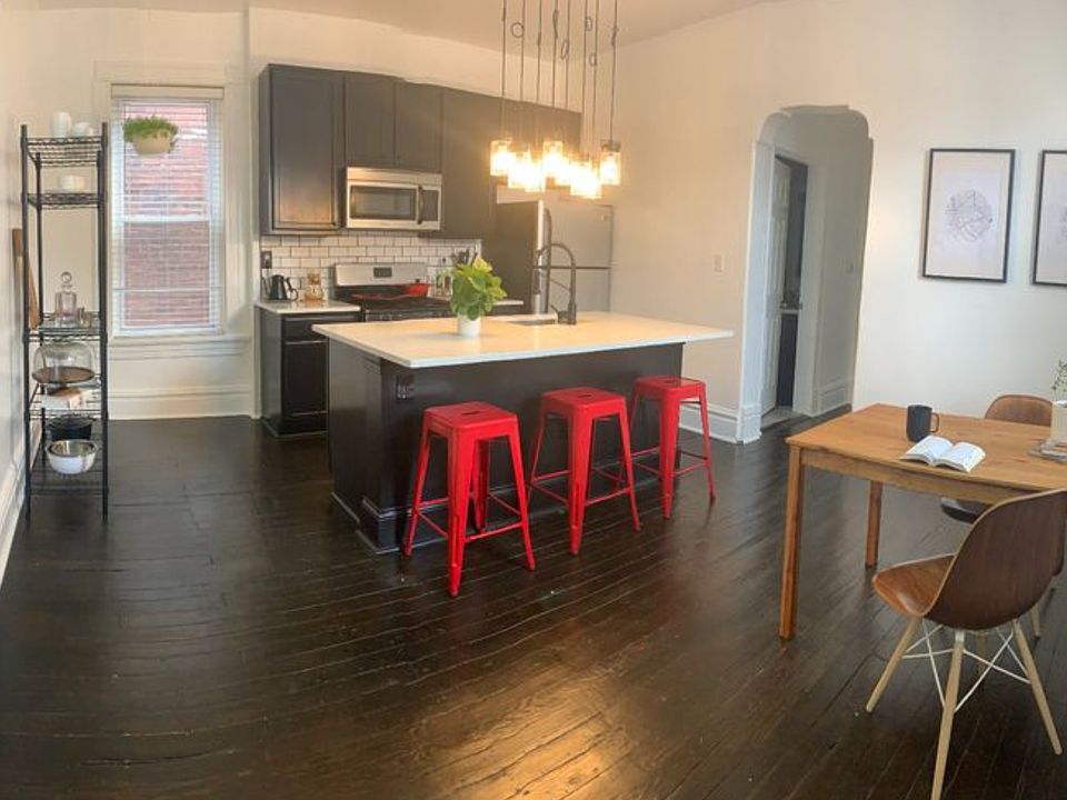 Kitchen from entry, showing access to hallway