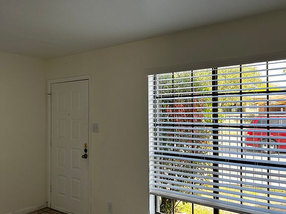Large window in living room to let in plenty of natural light