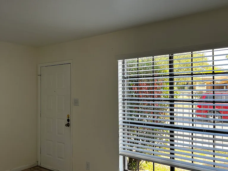 Large window in living room to let in plenty of natural light