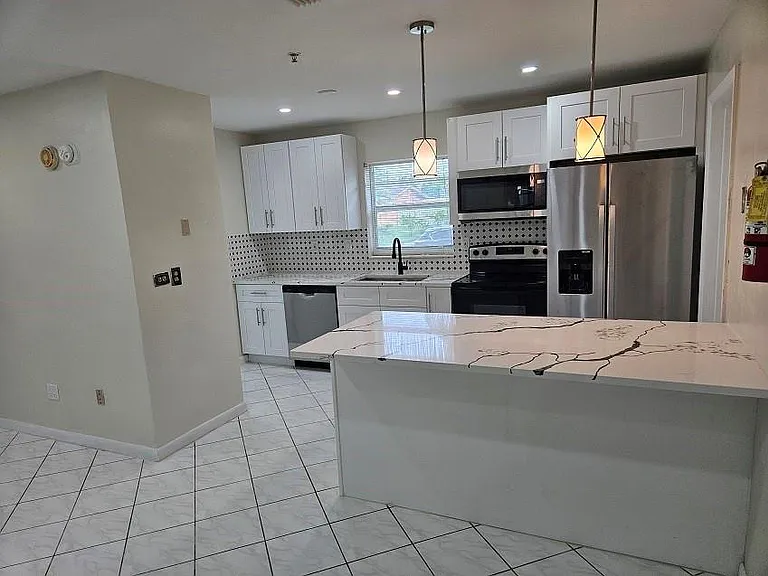 6380 NW 25th Ct — Photo 11