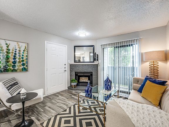 Open-concept living room with cozy fireplace and stylish design _ perfect for relaxing or entertaining.