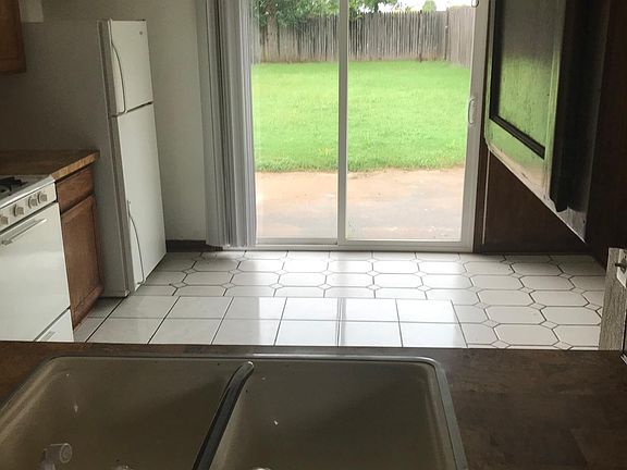 kitchen/dining area. sink has been replaced with a stainless sink.