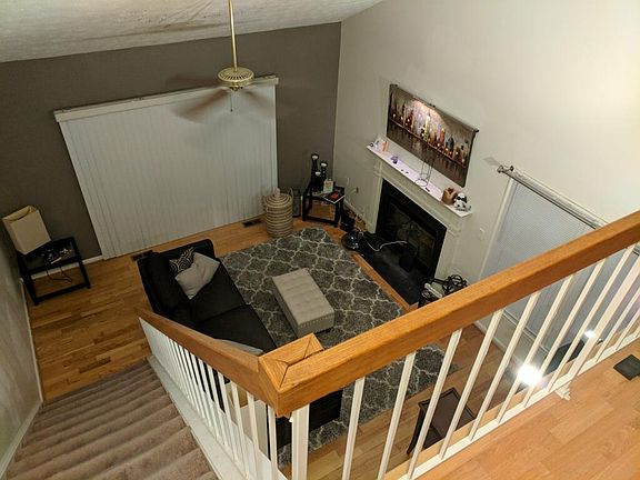 Family Room with wood burning fireplace and small deck