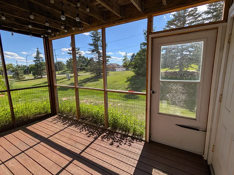 Screened in patio located off of the living room with easy access to shared yard.