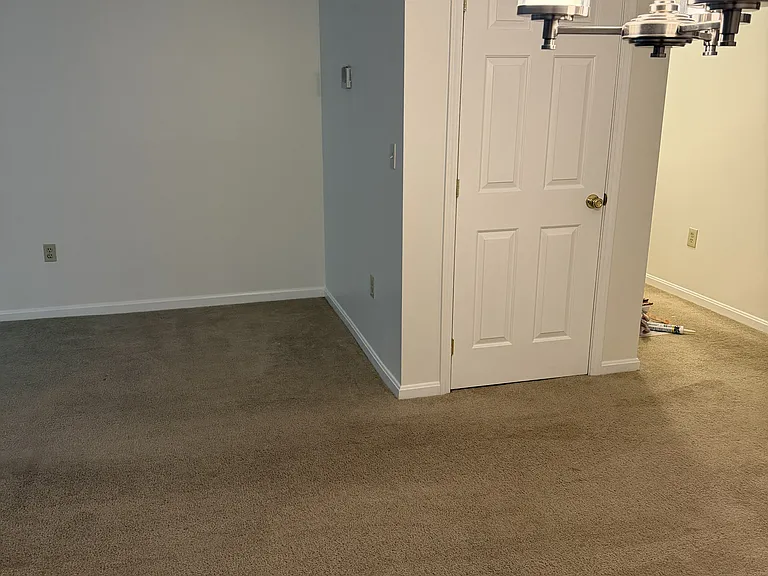 Looking from the dining area to the coat closet, the living room is on the left.