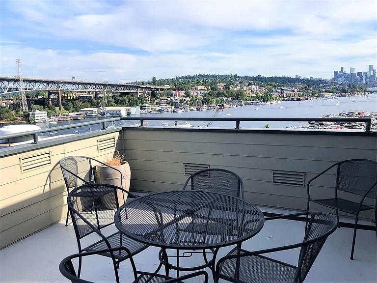 Rooftop deck with table and chairs for enjoying happy hour or dinner with a view!