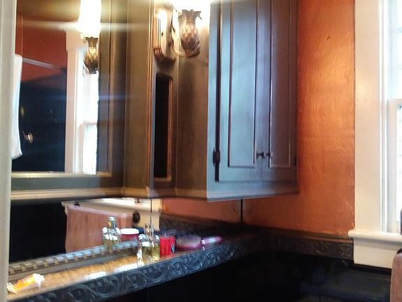 Obsidian Granite walls and Custom cabinetry Copper