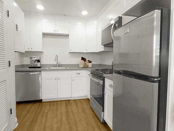 Solid wood cabinets, quart counters and stainless steel appliances (staging not included)