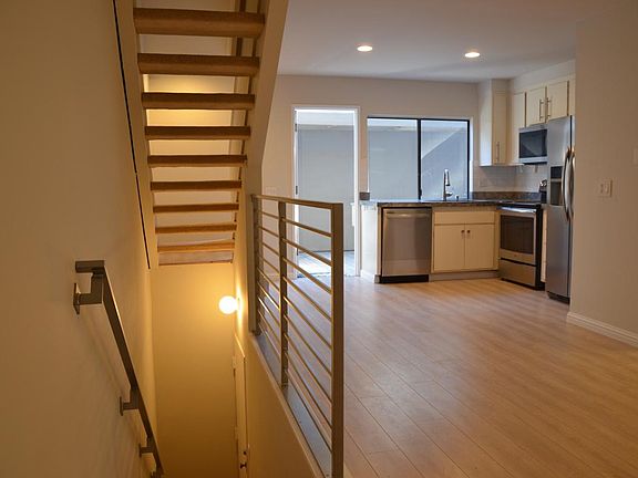 Living room & stairs to garage