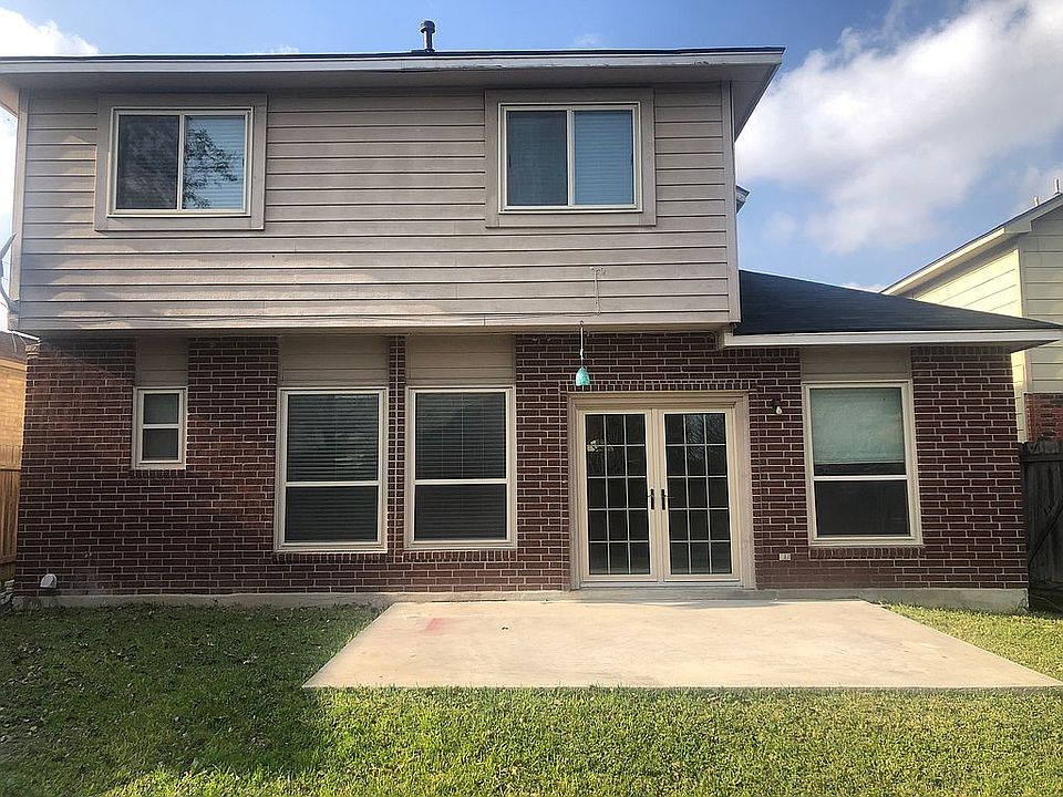 Back of the home with patio