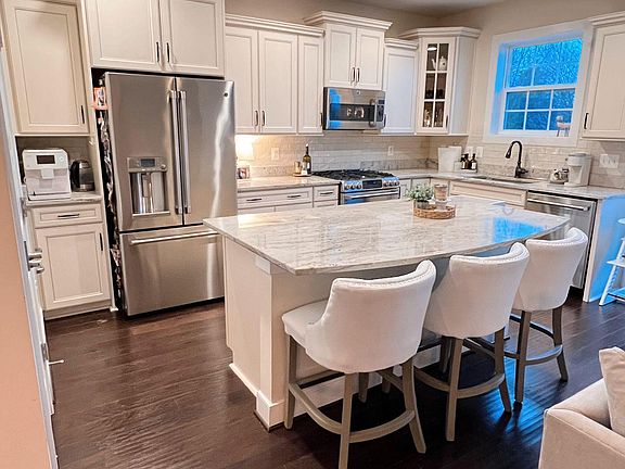 Kitchen with luxury cafe appliances, cabinets, and granite