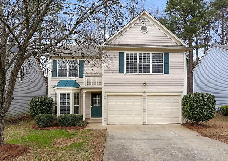 Frontview, two car garage, covered entry for easy rainy day access.
