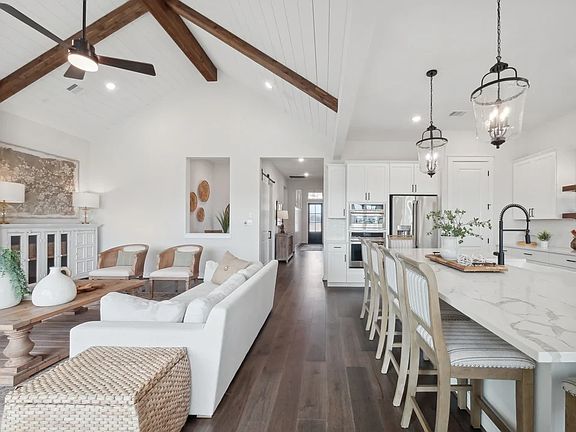 Kitchen with vaulted ceiling and pendant lighting