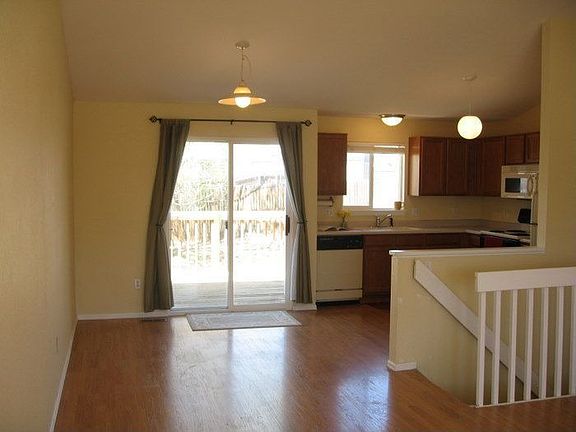 The eat-in kitchen opens to the back deck. 
