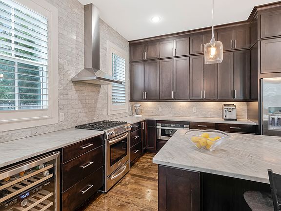 Kitchen with marble countertops and stainless steel appliances