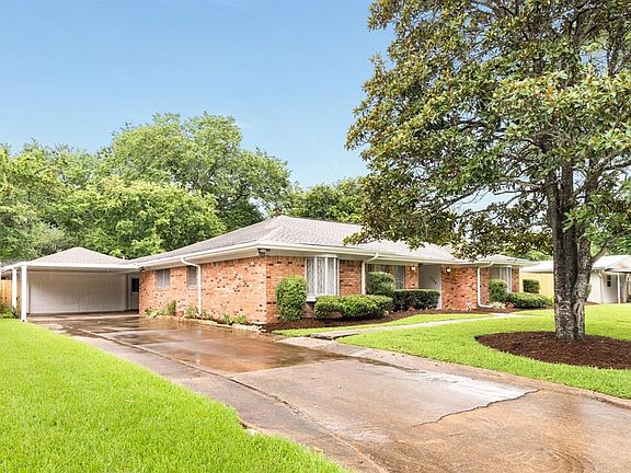 2 car semi-attached garage with carport