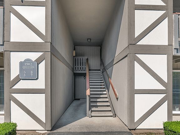 Covered stairwell access to upper and lower apartment homes.