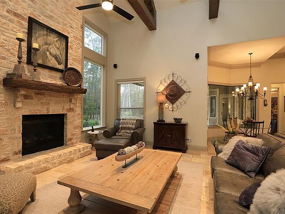 Family room with Vaulted ceiling and wood beams! Floor to ceiling stone Fireplace!