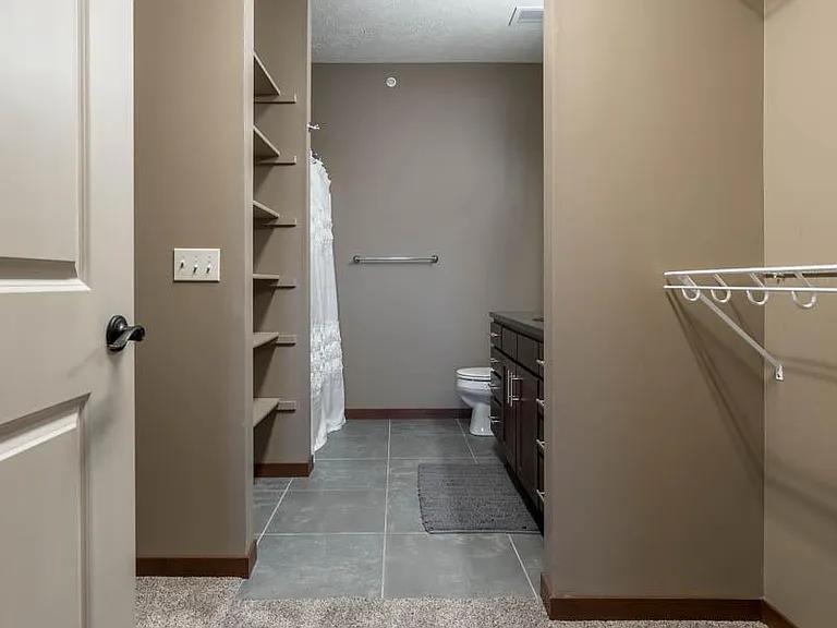 Spacious walk-in closets provide plenty of room to keep your wardrobe organized and accessible.