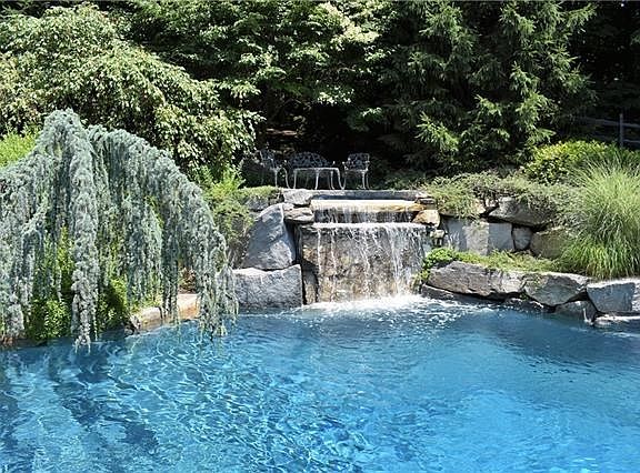 waterfall with sitting area above