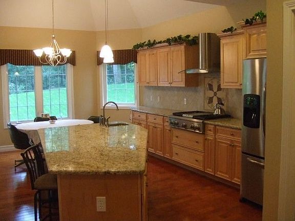Gourmet kitchen has been designed for cooking and entertaining. Granite.