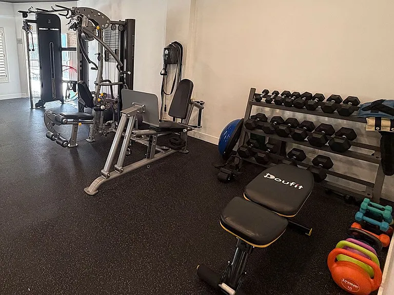 Fitness Center with Weight Machines and Free Weights.