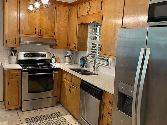 New quartz counter tops, stainless steel appliances, lighting, hardware, and tile backsplash!