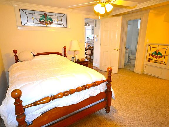 Bedroom with Jacuzzi and bath off the bedroom. Stained glass window overhead and on jacuzzi